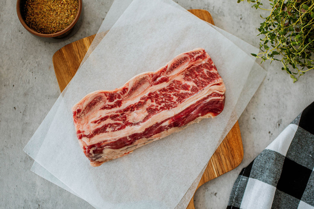 raw beef short ribs on a parchment paper 