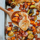 organic chicken breasts on a sheet pan for dinner