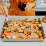 organic chicken breasts on a sheet pan for dinner